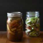 a jar of pickled rhubarb next to a jar of chopped rhubarb