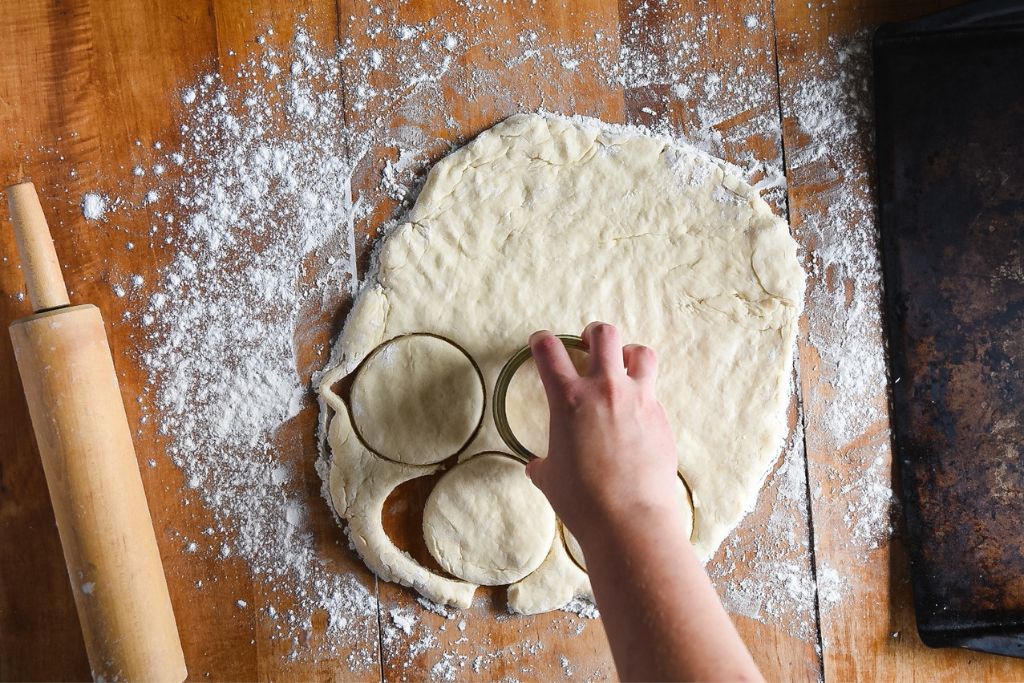 biscuit dough being cut out 