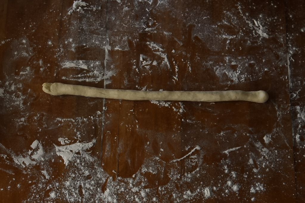 a rolled cylinder of dough