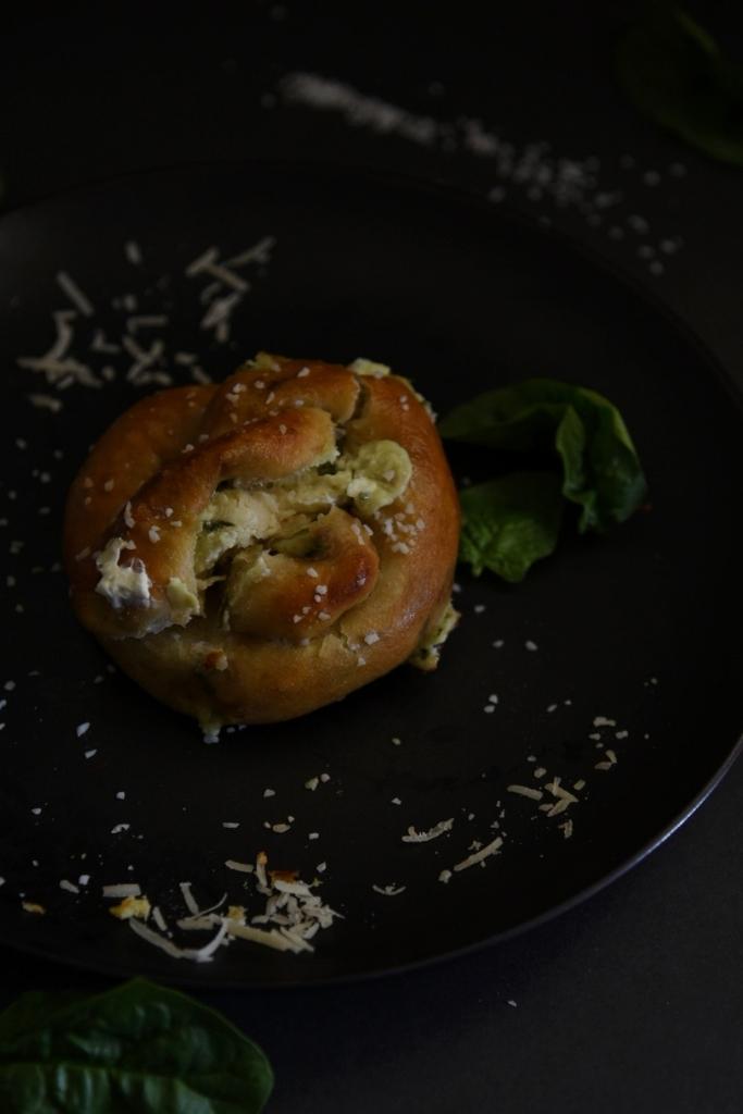 a pretzel that has been broken in half sitting on a plate