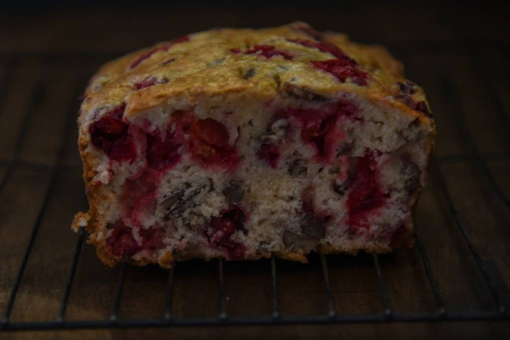a close of a cut loaf of bread on a cooling rack