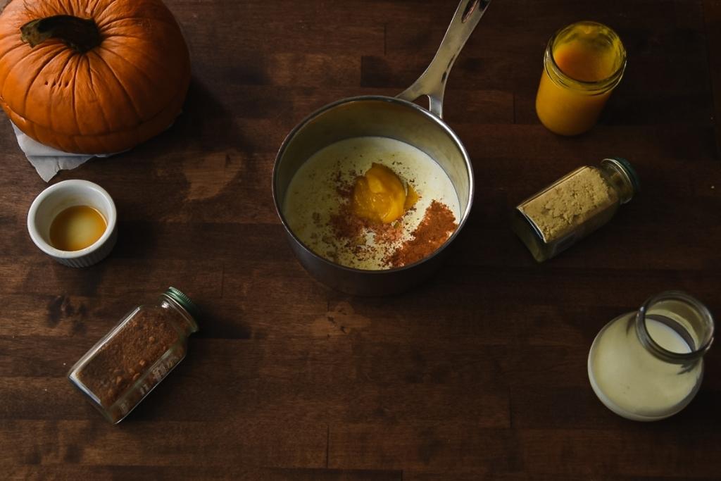 all there ingredients to make a pumpkin spice latte in to a pan