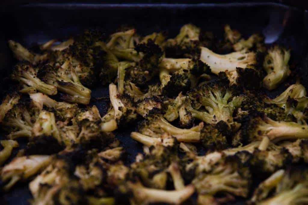 a close up of a pan of roasted broccoli