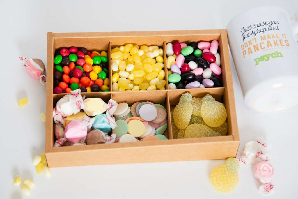 a finished candy box with candies and coffee cut next to it